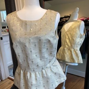 Metallic peplum top with exposed back zipper